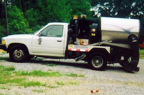 1991 Toyota with a Masco Sweeper